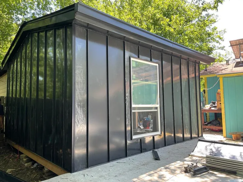 Black standing seam metal wall panels for Metal Roof Installation in Woodward